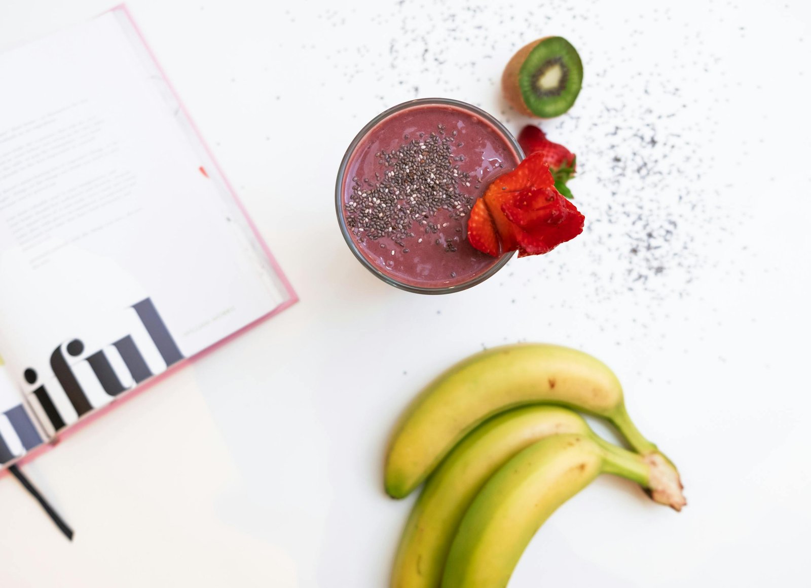 Three Bananas Near A Fruit Shake